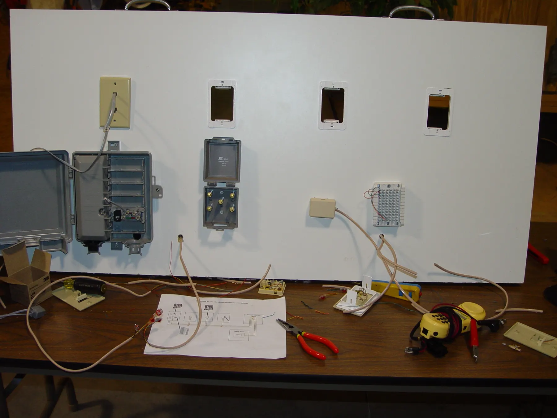 Training still: phone and drop board