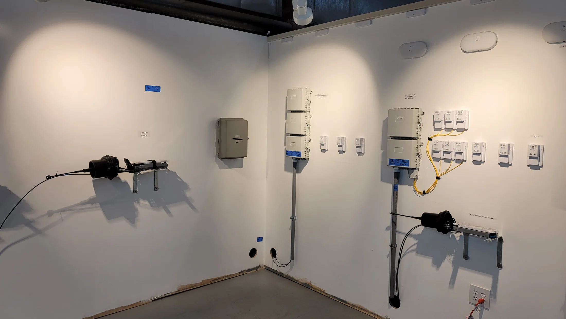 Issued lab still, 2021-02-02: a bank of ONTs on the wall, "Pill Boxes" overhead and the network is HUMMING with blazing speed!