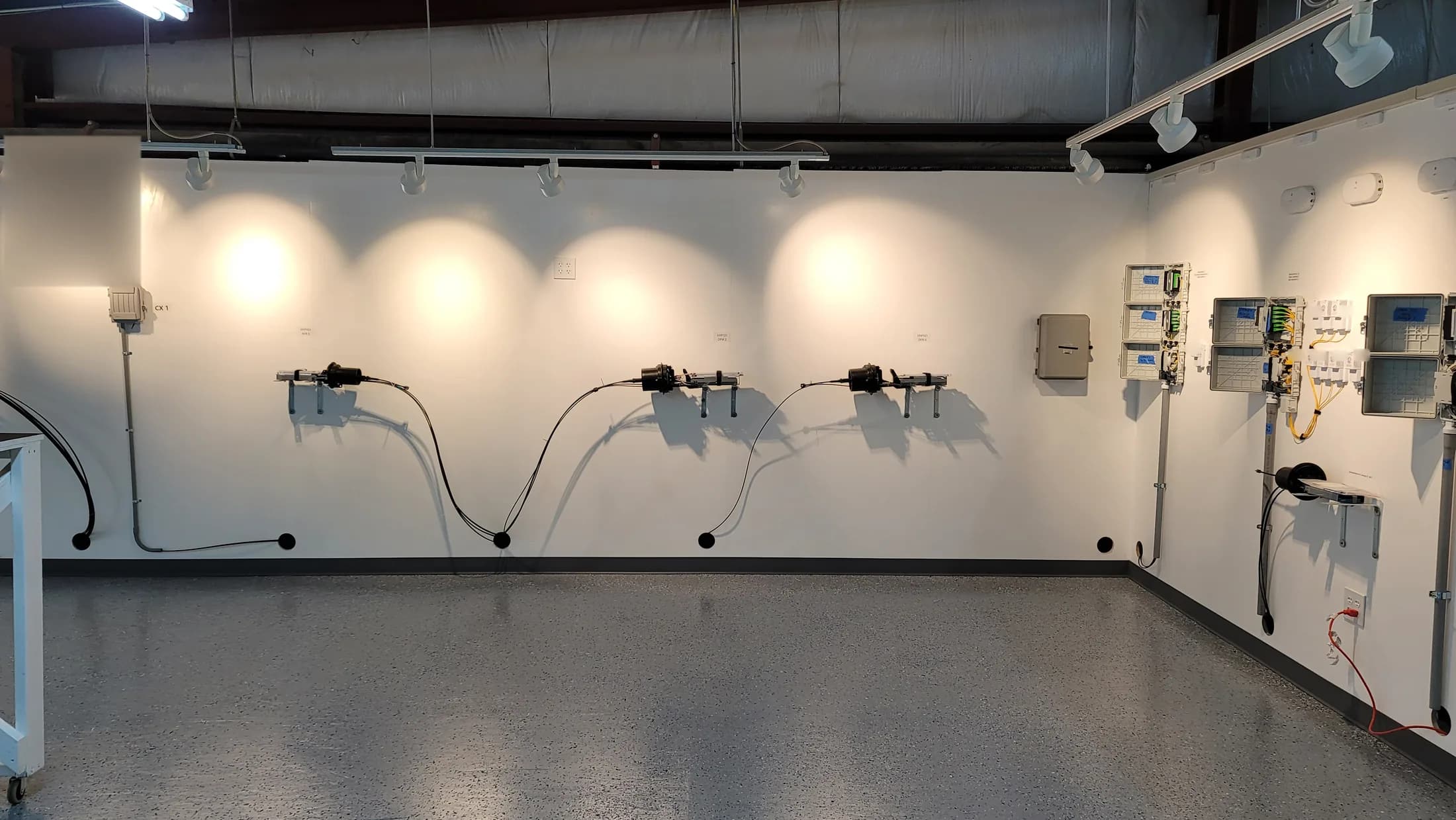 Issued lab still, 2021-02-10: the closures on the left feed the NDPs and ONTs on the right; the light is flowing